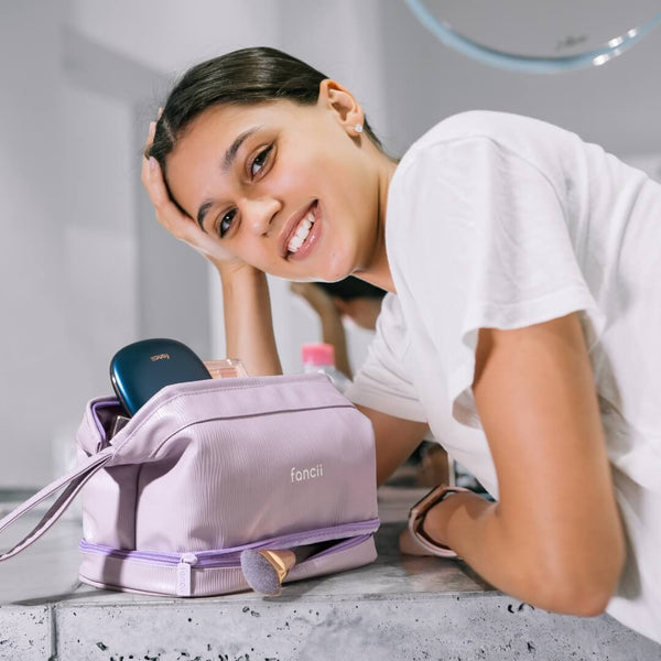 Macy 2-in-1 Makeup Bag by Fancii & Co. in Purple with model.