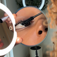Using Taylor Lighted Compact 10x side to do mascara