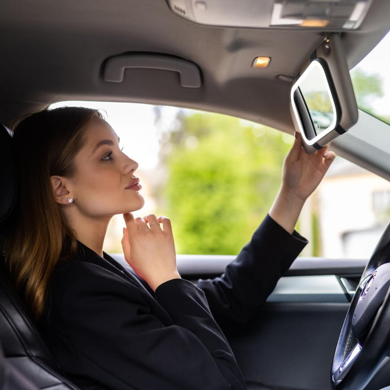 Juni Universal Lighted Car Mirror by Fancii & Co.  in Black being used in the car. 