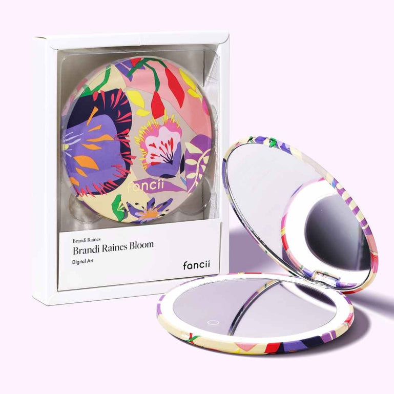Mini Taylor Lighted Compact Mirror By Fancii & Co. in Brandi Raines Bloom shown open and lit up beside the box packaging