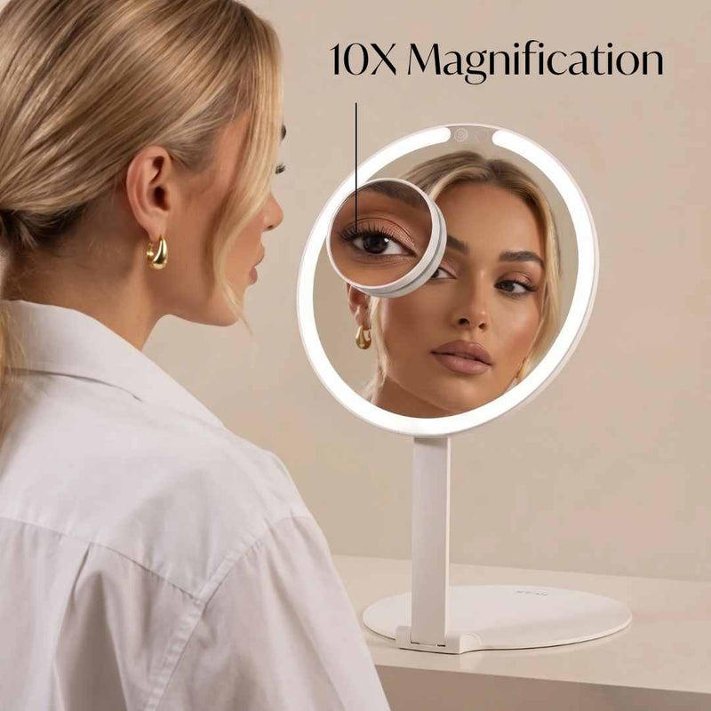 Abigail with Tara Travel Vanity Mirror by Fancii & Co. with 10x Magnifier showing precision details