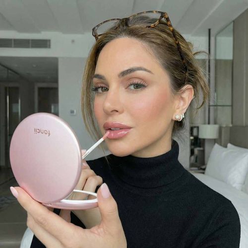 Taylor Lighted Compact in Rose Gold in use by woman with readers on head