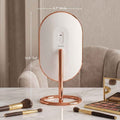 Abigail with Tara Travel Vanity Mirror by Fancii & Co. with 10x Magnifier showing precision details