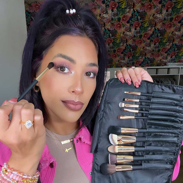 Woman with the ARIA makeup brush set by Fancii and Co in Velvet