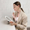 Woman using Fancii Lana 10x magnifying mirror with lights in Chrome