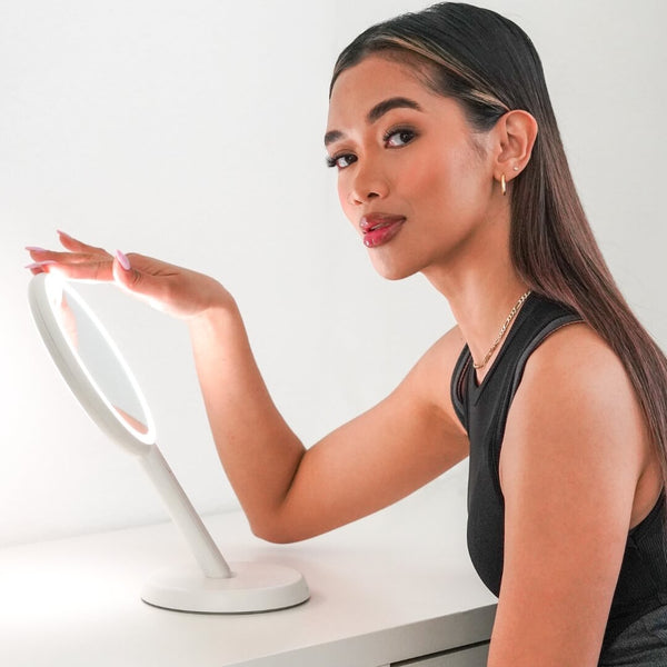 Cami handheld makeup vanity mirror features 3 dimmable led light by Fancii and Co All