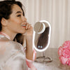 Woman using the Vera Vanity Mirror with Lights & Lara 10X Magnifying Mirror All