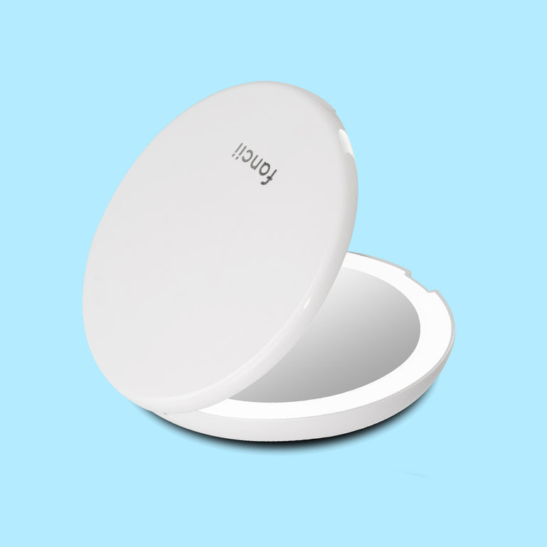 Mini Lumi lighted compact mirror with 1x/10x magnifying by Fancii and Co in_Silk White