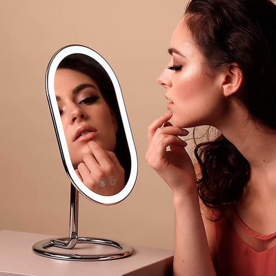 Woman using the Vera Vanity Mirror with Lights & Lara 10X Magnifying Mirror to take of f makeup All