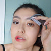 Female using Zoe EYE to effortlessly remove eye makeup